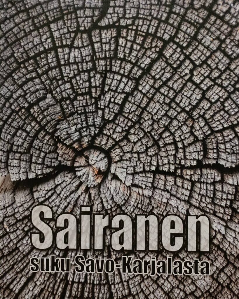 Kuvassa sukukirjan kansi